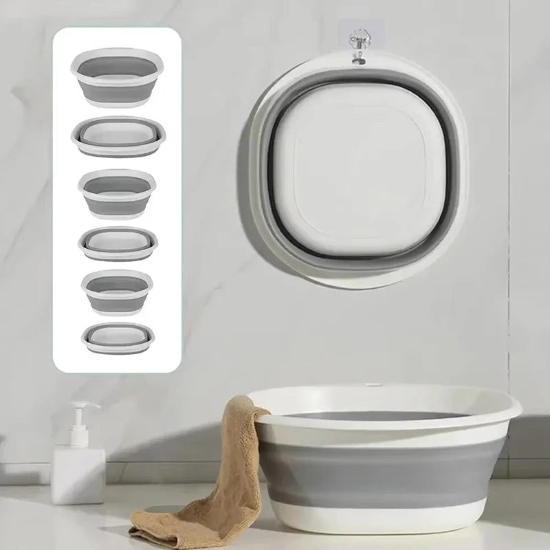 Baignoire bébé pliante grise et blanche – gain de place, suspendue au mur et dépliée pour le bain