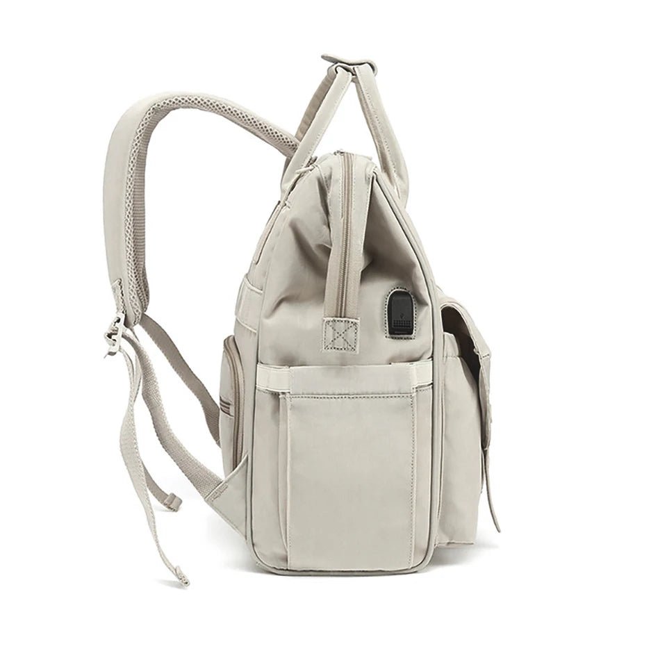 Sac à langer format sac à dos avec compartiments isothermes et accessoires pour bébé