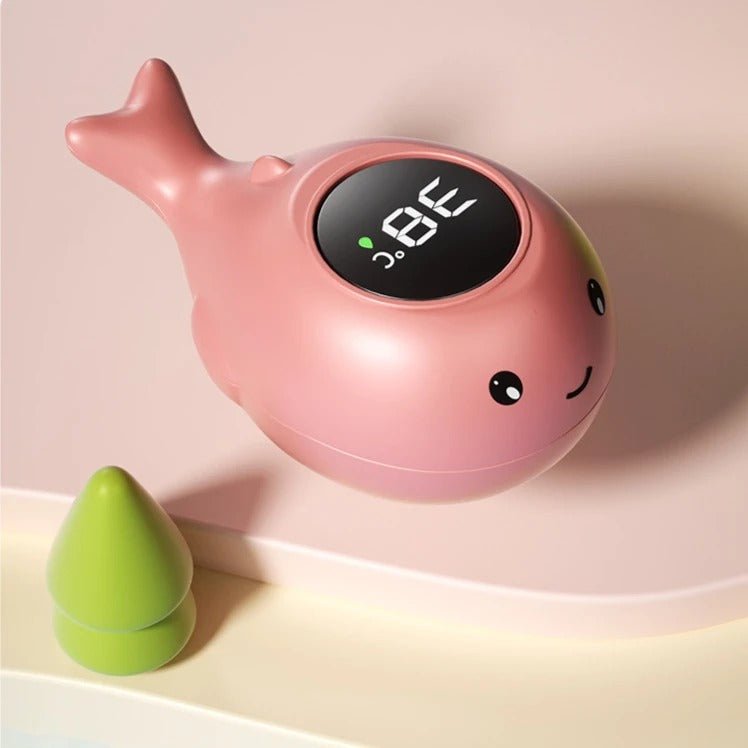 Thermomètre de bain bébé en forme de baleine rose, affichage numérique à rétroéclairage, flotte sur l'eau.